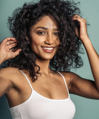 young-woman-with-curly-hair-portrait-2024-10-18-05-44-21-utc (1)